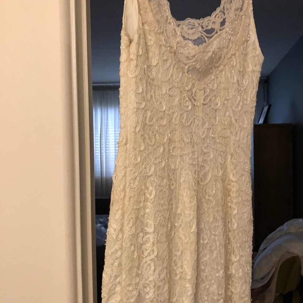 Ivory beaded evening dress.